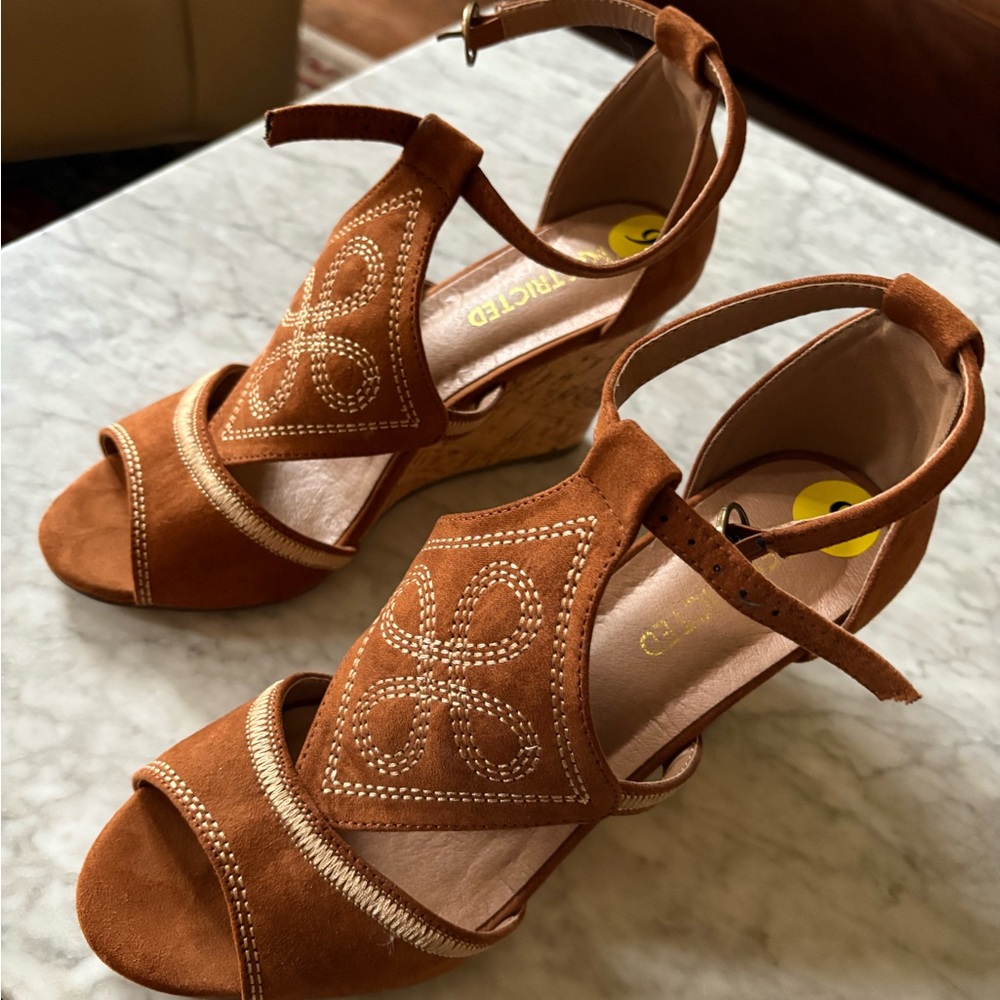 New Restricted wedge sandals size 9.